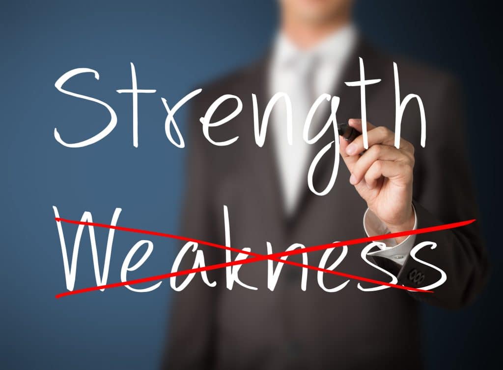 A writing on the board with white pen that Strength based approach is about focusing on our strengths not weakness