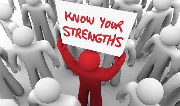 a Billboard showing a red man saying KNOW YOUR STRENGTHS in a rally about strengths leadership in Australia