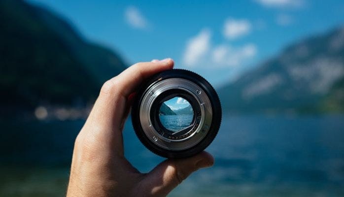 Seeing through the lens of camera thus reimaging the blurred canvas of life in mountains signifying the power of satori attitude in coastal areas
