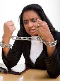A woman tied her own arms in chains showing the lack of flexibility in environment